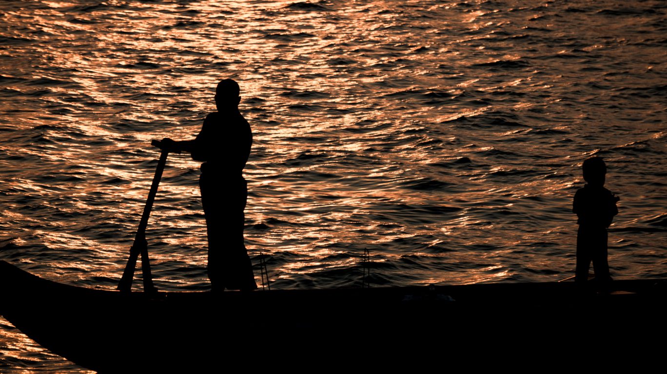 Silhouetted Fisherman
